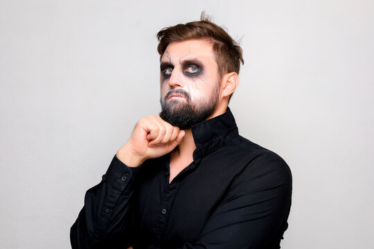 halloween makeup bearded man posing on camera