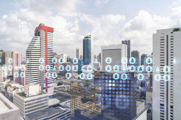 Social media icons hologram over panorama city view of Bangkok, Southeast Asia. The concept of people networking, connections and career opportunities. Double exposure.