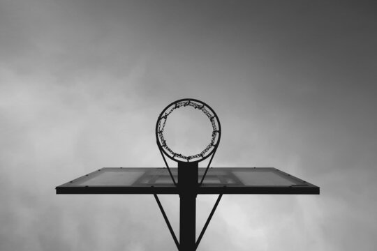 Black and white photograph of a basketball hoop      