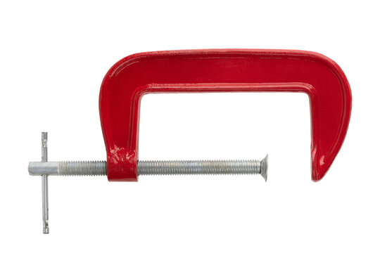 Red clamp on a white background. Joiner's clamp close-up.