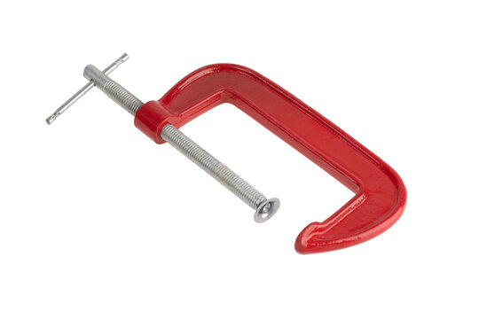 Red clamp on a white background. Joiner's clamp close-up.
