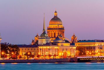Fototapeta na wymiar Saint Petersburg cityscape with St. Isaac's cathedral, Admiralty building and Palace bridge at sunset, Russia