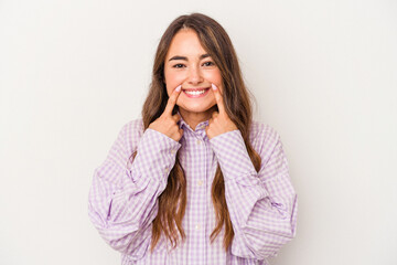 Young caucasian woman isolated on white background doubting between two options.