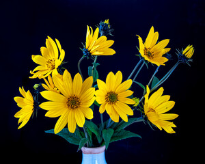 bouquet of yellow flowers on black background