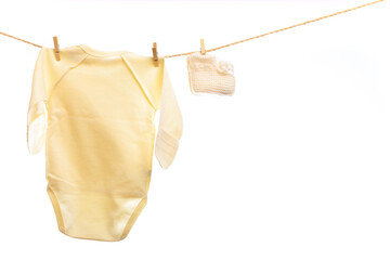 Baby clothes on a clothesline on white  background