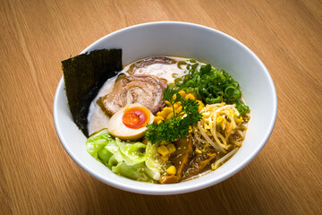 Japanese food, Sapporo Miso. Ramen in pork broth with miso, chashu meat, spring onion, marinated bamboo, marinated egg, narutomaki, corn, nori seaweed, bean sprouts