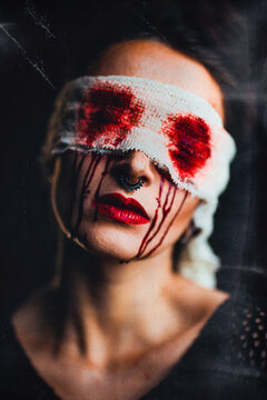 girl with bloody makeup black eyes fiery mood hands with rings obscure feeling