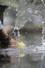 Beautiful water splash with blurred background in the fish pond