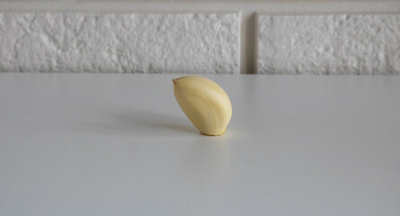 Garlic clove isolated on a white kitchen table background