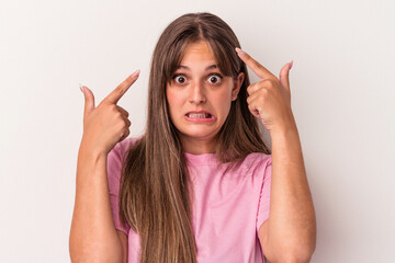 Young caucasian woman isolated on white background showing a disappointment gesture with forefinger.