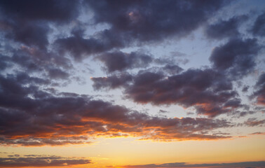 Fototapeta na wymiar dramatic sky skyline background. orange clouds at sunset 