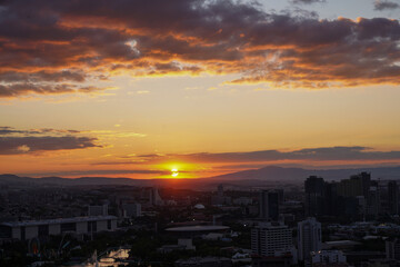 Obraz premium yellow and orange clouds at sunset. dramatic sky skyline background 