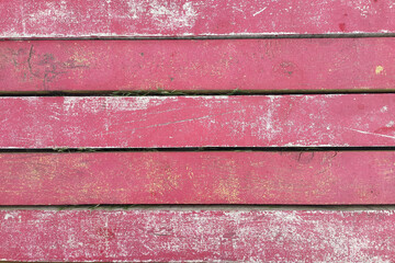 Old wooden texture with grunge pink paint. Wood texture in vintage style.