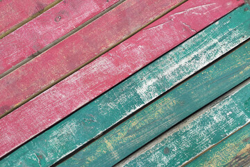 Old wooden texture with grunge pink and blue paint