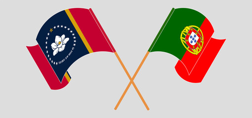 Crossed and waving flags of The State of Mississippi and Portugal