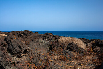 Fototapeta na wymiar View of the lava beach of Linosa Called Mannarazza