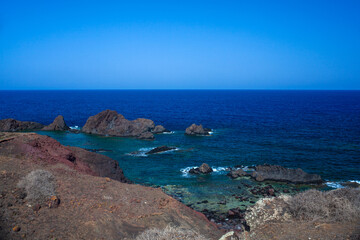 View of the lava beach of Linosa Called Faraglioni