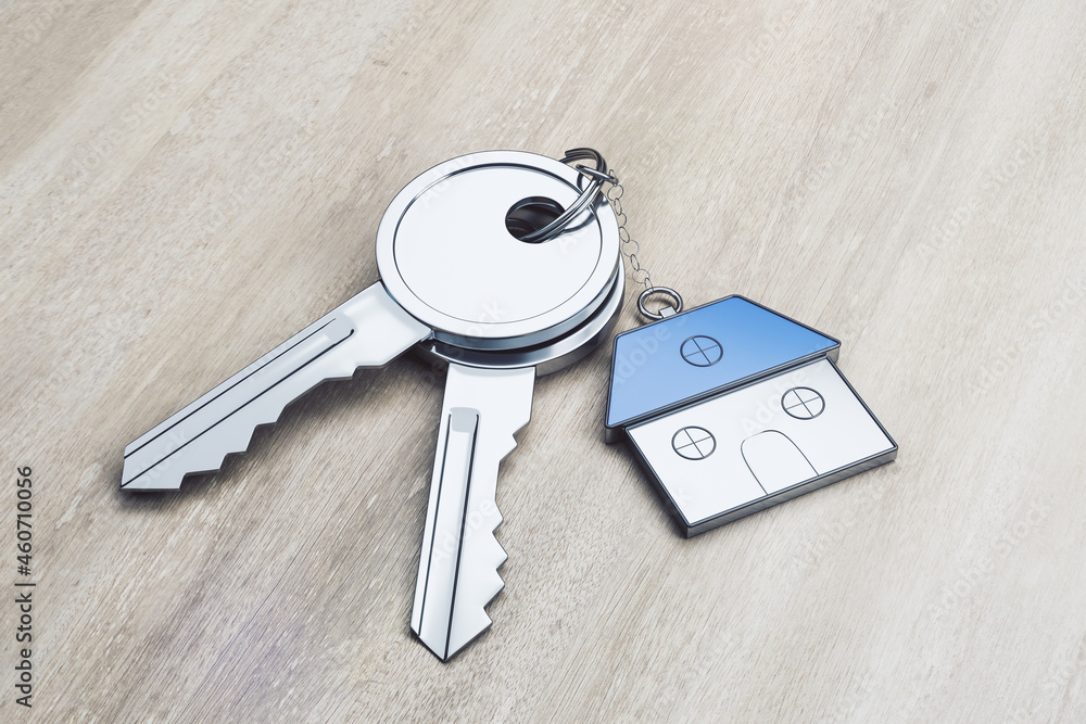 Poster Close up of keys with house keychain on wooden background. Real estate and property concept. 3D Rendering.