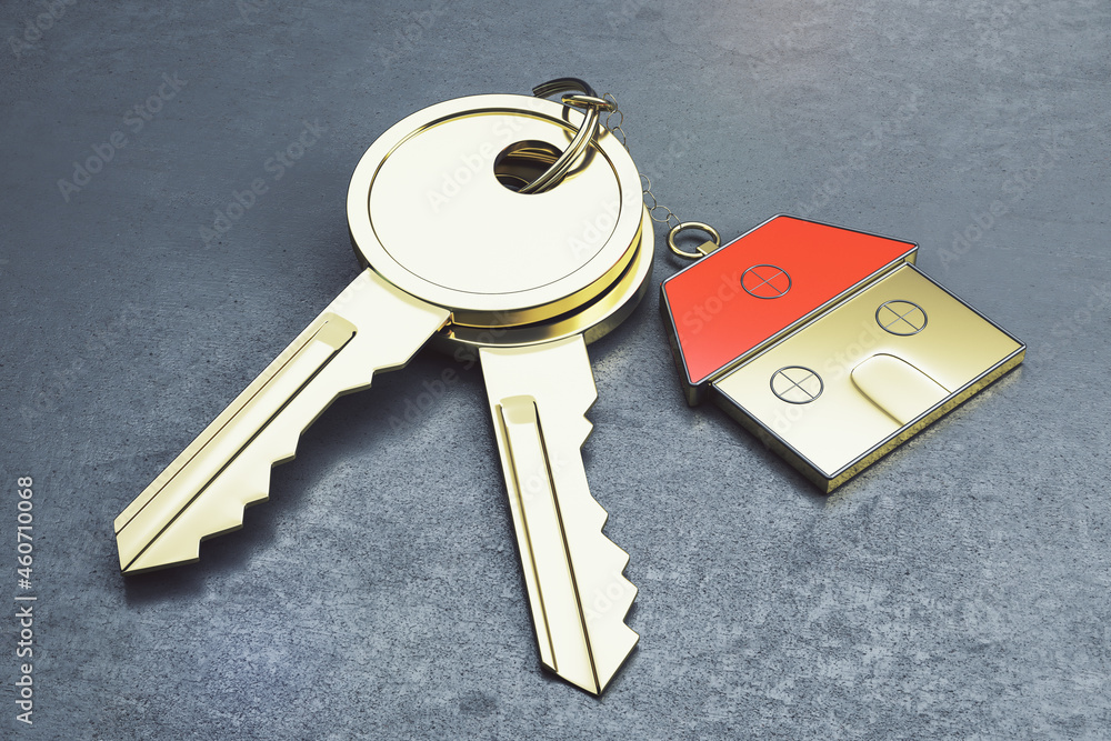 Poster close up of keys with house keychain on gray surface background. real estate and property concept. 3