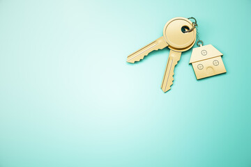 Close up of keys with house keychain on blue surface background with mock up place. Real estate and property concept. 3D Rendering.