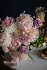 Beautiful flowers. Preserved roses with dried flowers bouquet closeup. Beautiful flower arrangement in a pink box.