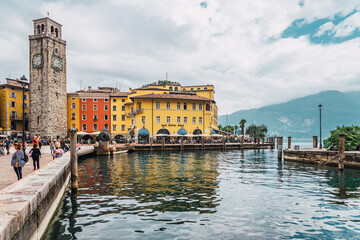 Obraz na płótnie Canvas Riva del Garda, Italy - September 22, 2021: Colorful streets of the beautiful Italian town of Riva at the foot of the mountains and on Lake Garda
