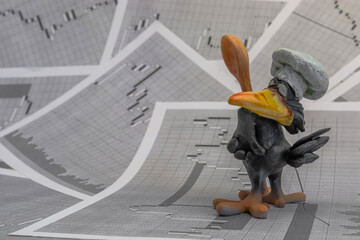 Crow chef on the background of stock price charts. The symbol of manipulation in stock trading. The...
