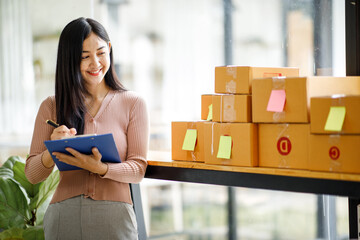 Portrait of Starting small businesses SME owners female entrepreneurs working on receipt box and...