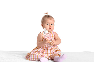 Cute baby girl with bottle of water on white background