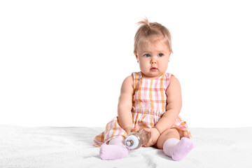 Cute baby girl with bottle of water on white background