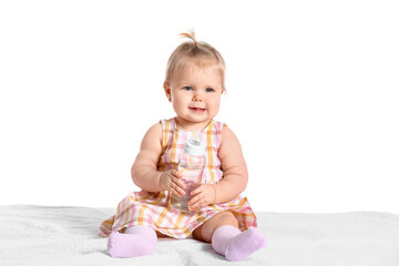 Cute baby girl with bottle of water on white background