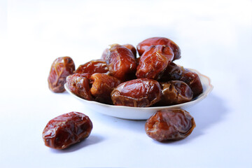 ripe dates on plate, brown, sweet, arabic, with isolated background
