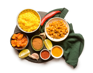 Traditional Indian food and spices on white background