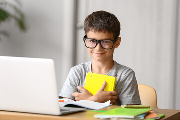 Little boy doing lessons at home