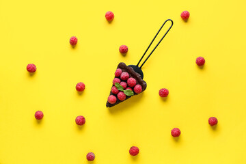 Spatula with piece of tasty raspberry pie and mint on color background