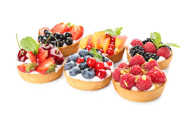 Tasty berry tartlets on white background