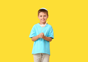 Little boy with decor for Rosh Hashanah (Jewish New Year) on color background
