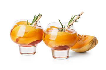 Glasses of delicious melon cocktail on white background