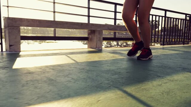 close up foot running with sunlight background,slow motion