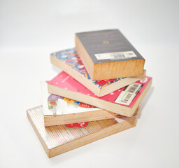 stacks of books on white background high angle view