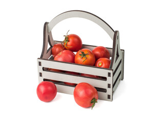 Grey wooden box and ripe red tomatoes isolated on a white background.