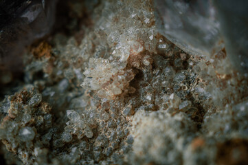 A sample of rock with amethyst under great magnification. Mountain mineral with crystals. Macro, horizontal composition