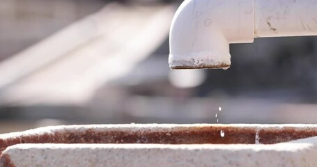 Water Drops Dripping From An Open Water Line. Water Wastage Concept. close up