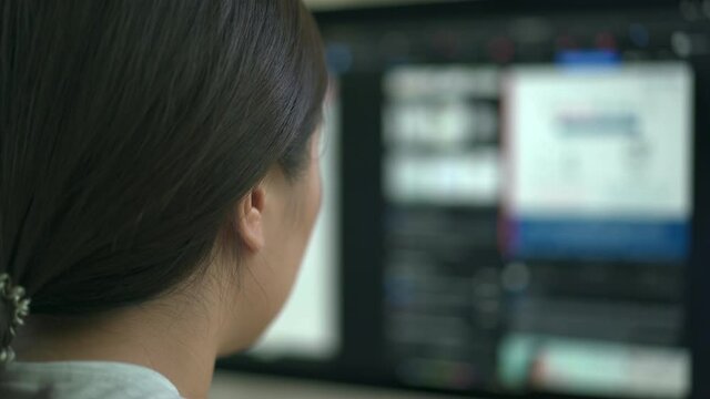 Asian woman working at home.