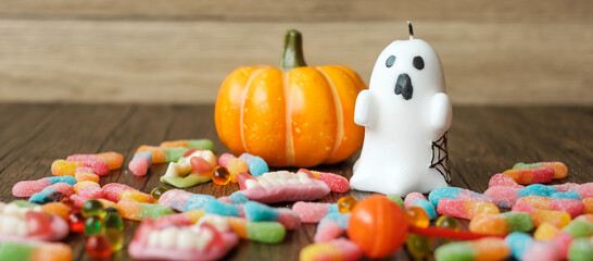 Happy Halloween day with ghost candies, pumpkin bowl, Jack O lantern and decorative (selective focus). Trick or Threat, Hello October, fall autumn, Festive, party and holiday concept
