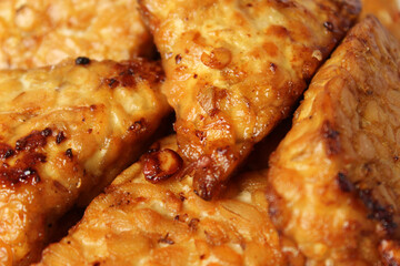 fried tempeh healthy food golden tasty, soybeans fermented, close up images, background texture
