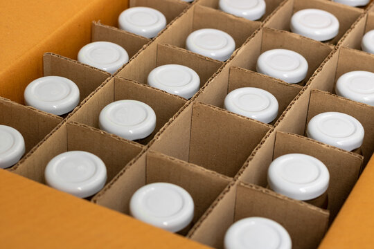 glass bottles in a cardboard box with partitions for transporting broken items.