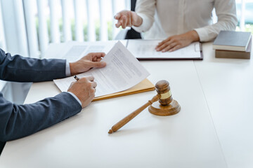 Lawyer Legal counsel presents to the client a signed contract with gavel and legal law. justice and...