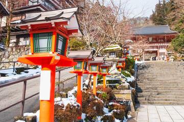 orange vintage lamp and lamppost on street at japan temple in winter