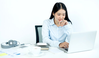 Working Asian women feel stressed, dismal tired from work, migraine headaches from hard work while working at the office